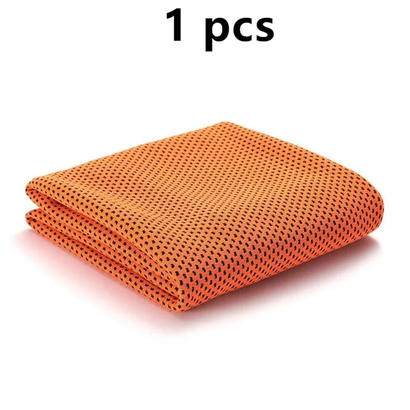 One orange ultra soft quick-dry sport towel folded neatly.