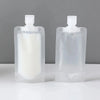 A clear plastic refillable travel squeeze bottle set for toiletries, showing two bottles.