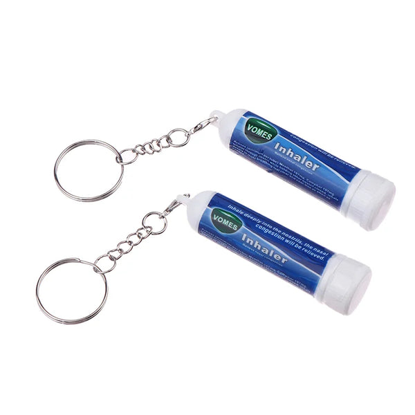 A pair of VOMES Inhaler nasal relief sticks with metal chains