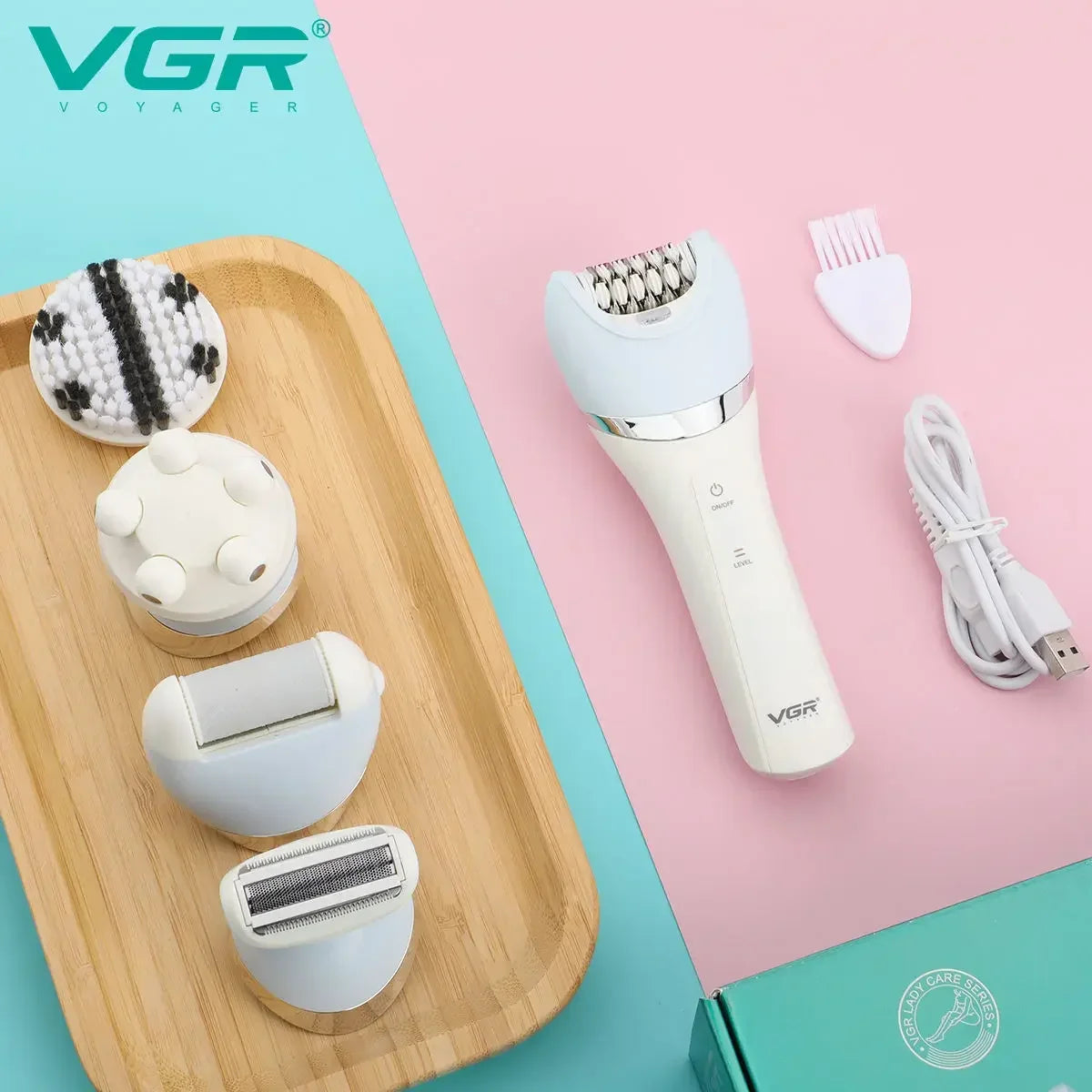 A VGR Voyager 5-in-1 electric grooming kit with multiple attachments displayed on a wooden tray.