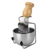 A men's shaving set featuring a wooden handle and a stainless steel bowl with a shaving brush.