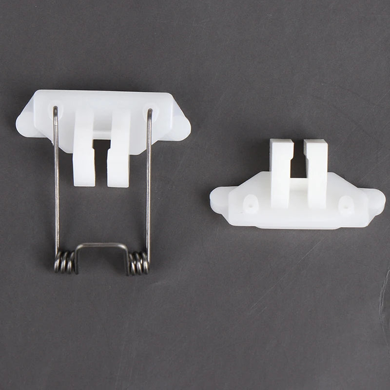 A white hair clipper swing head replacement parts kit showing a plastic clip and a metal wire hook.