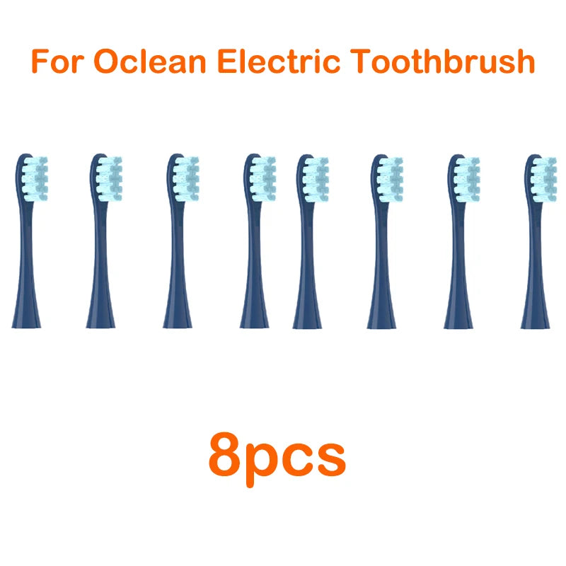 Eight replacement brush heads for an Ocean electric toothbrush are displayed in a row.