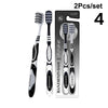 Un set de quatre brosses à dents professionnelles à double poil emballées dans une boîte.