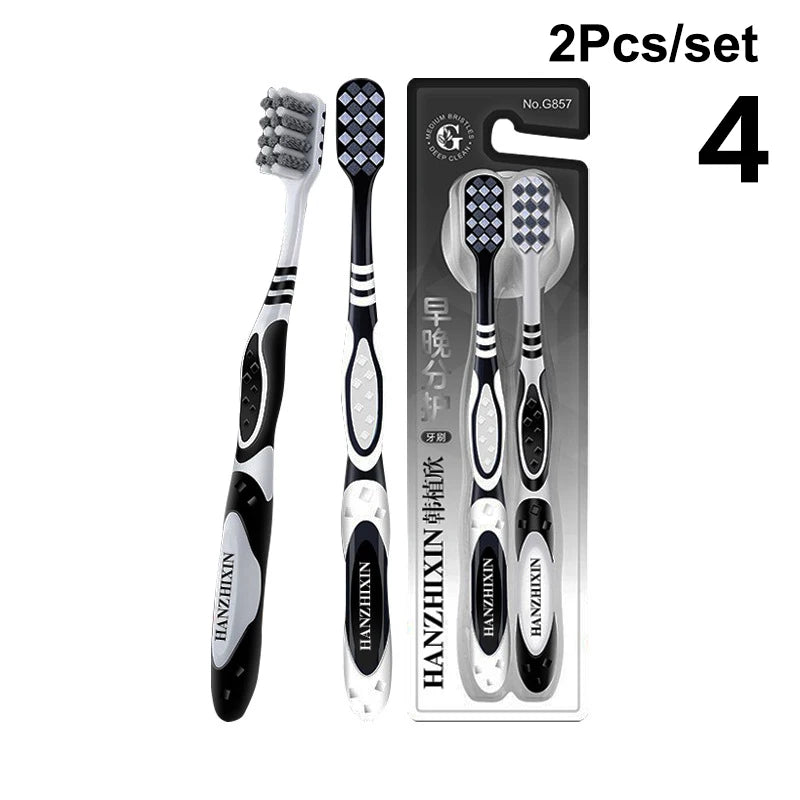 Un set de quatre brosses à dents professionnelles à double poil emballées dans une boîte.