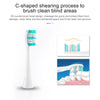 A white toothbrush with C-shaped brush heads is shown next to close-ups of the brush heads cleaning teeth and gums.