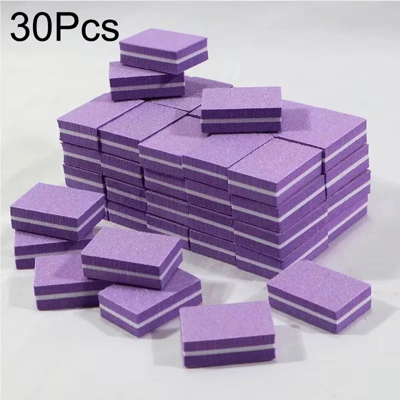 A stack of purple multi-sided nail and cuticle buffing files.