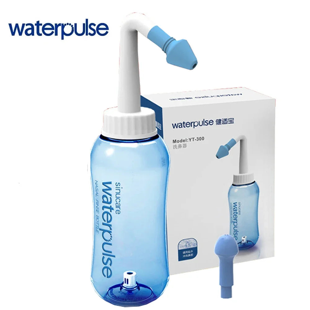 A blue waterpulse nasal irrigation rinse bottle with a white nozzle and a box in the background.