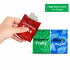 A hand holds a red bag of Cinnamon Spice flavour cores and two blue bags of Raspberry Fruity and Minty Magic flavour cores.