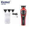 Red Kemei KM-999 cordless electric hair clipper with a detachable guard and cleaning brush.