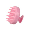 A pink silicone scalp massage and body brush with numerous pointed bristles.