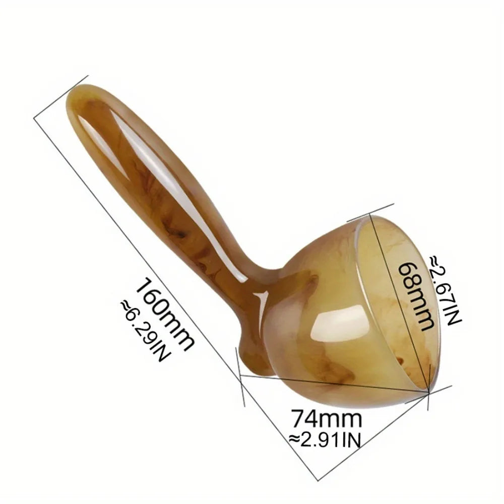 A golden-toned resin gua sha scraping massage tool shown in profile with dimensions marked.