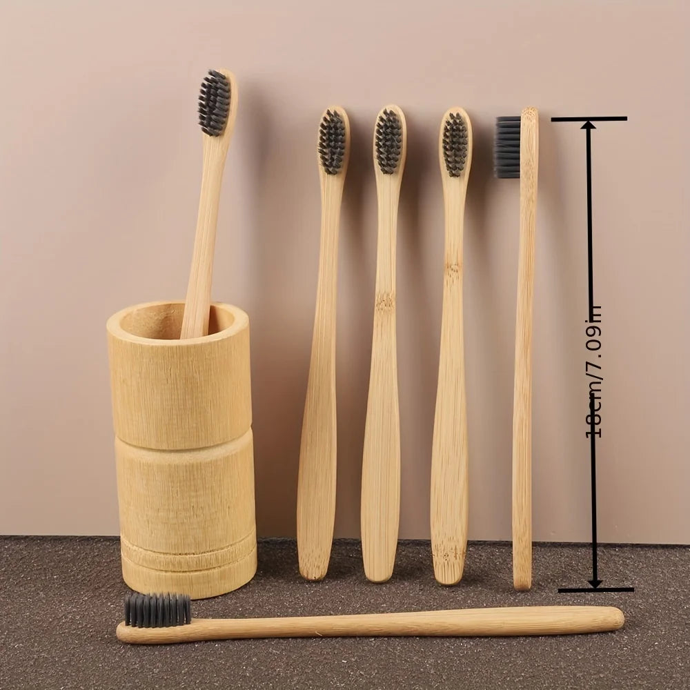 A set of six bamboo toothbrushes with soft bristles displayed against a neutral background.