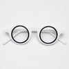 Paire de lunettes de lecture à monture blanche transparente avec des montures noires et des branches blanches.