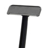 A black manual back hair shaver with a flat blade and a handle.