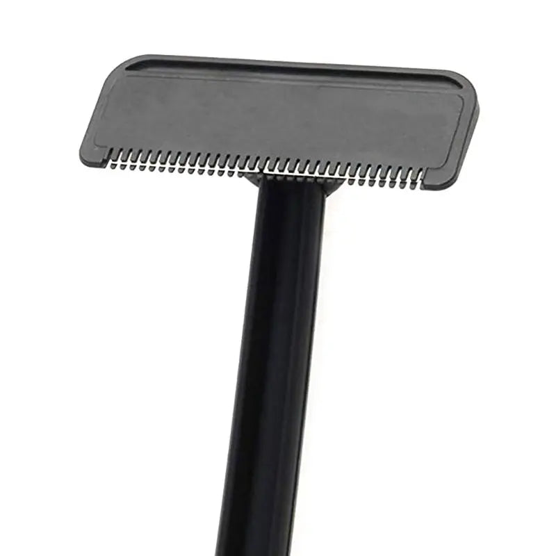 A black manual back hair shaver with a flat blade and a handle.