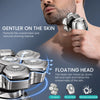 Close-up of a stainless steel floating head shaver being used on a man's face for shaving.
