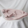 A light pink comfortable 3D sleeping eye mask is displayed on a white fabric background.