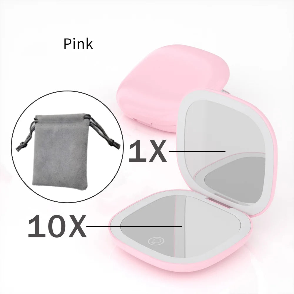 Pink compact LED makeup mirror showing a 1x and 10x magnification view.