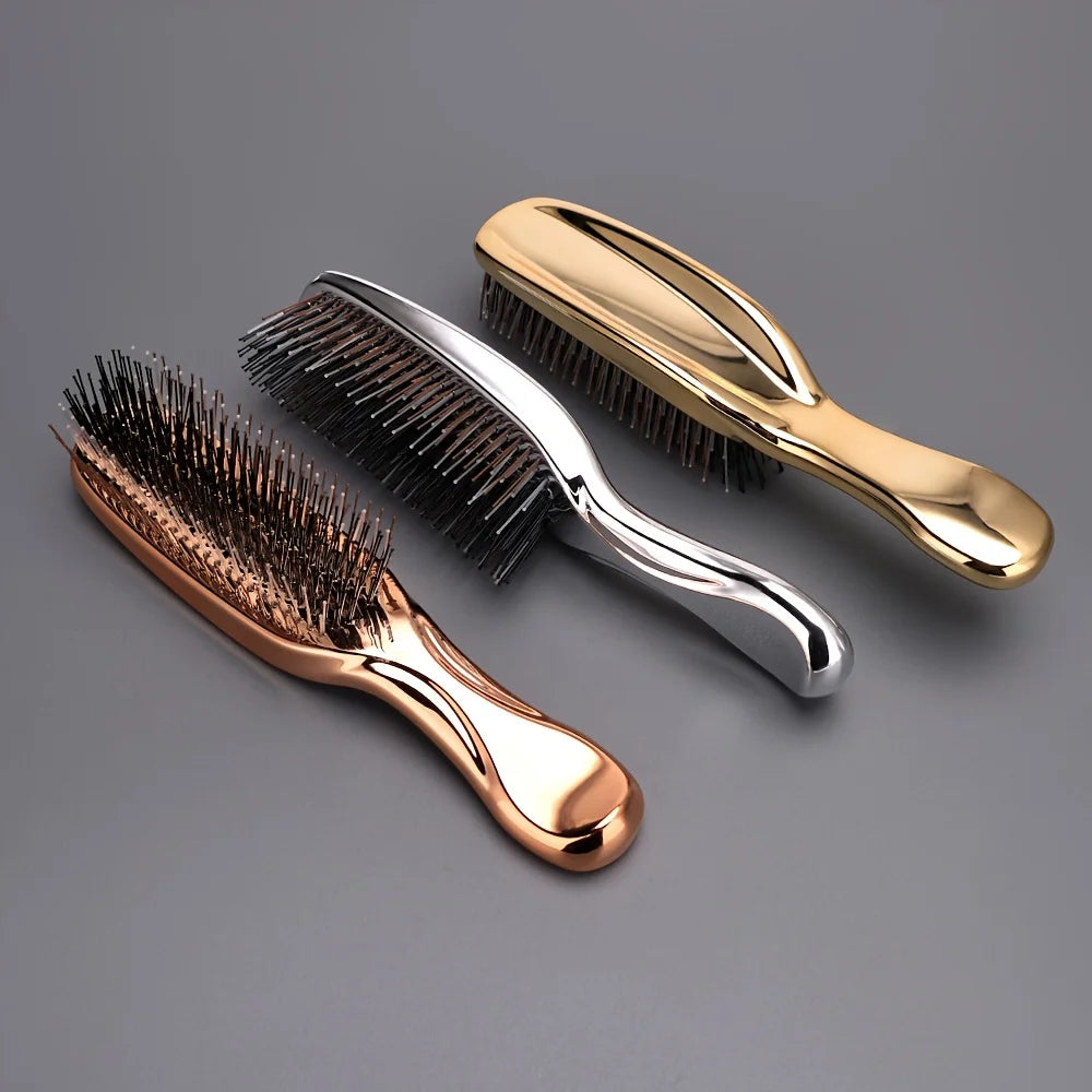 A set of gold and silver Japanese-style scalp massage brush combs for hair styling and relaxation