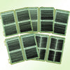 A collection of individual lash clusters in various sizes and styles displayed in green packaging.
