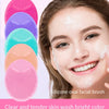 A woman is applying a clear and tender skin wash facial brush to her face for skincare.