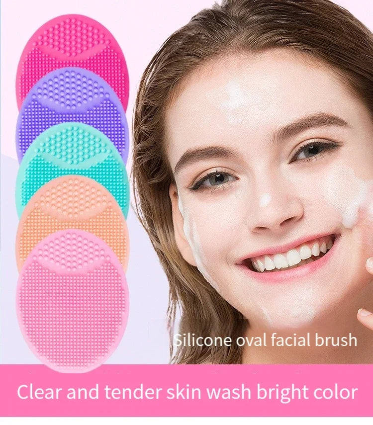 A woman is applying a clear and tender skin wash facial brush to her face for skincare.