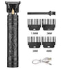 A set of professional electric hair clippers with dragon designs and various length guards.