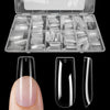 Un étui en plastique transparent contenant un ensemble de pointes à ongles pressables de différentes formes et tailles, affic