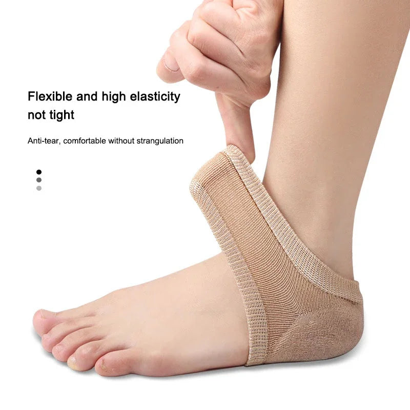 Close-up of a person's foot wearing beige silicone heel protectors for pain relief