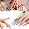 Close-up of various nail art designs and manicures displayed under a portable rechargeable UV nail dryer lamp.