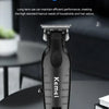 A black Kemi electric hair and beard trimmer is shown on a dark surface.