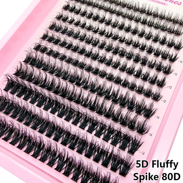 A set of 5D fluffy spike eyelashes in black shown on a pink tray.