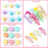 A collection of colorful butterfly hair pins, flower claw clips, and various hair clips for kids.
