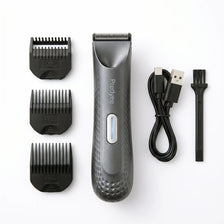 A gray electric body and pubic hair trimmer with multiple guard attachments and a charging cable.