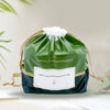 A green bag of immortals thick and skin friendly wet wipe type towels with a white bow.