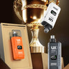 A gold trophy is displayed next to an orange and a black electric trimmer for nose, ear, and eyebrow grooming.
