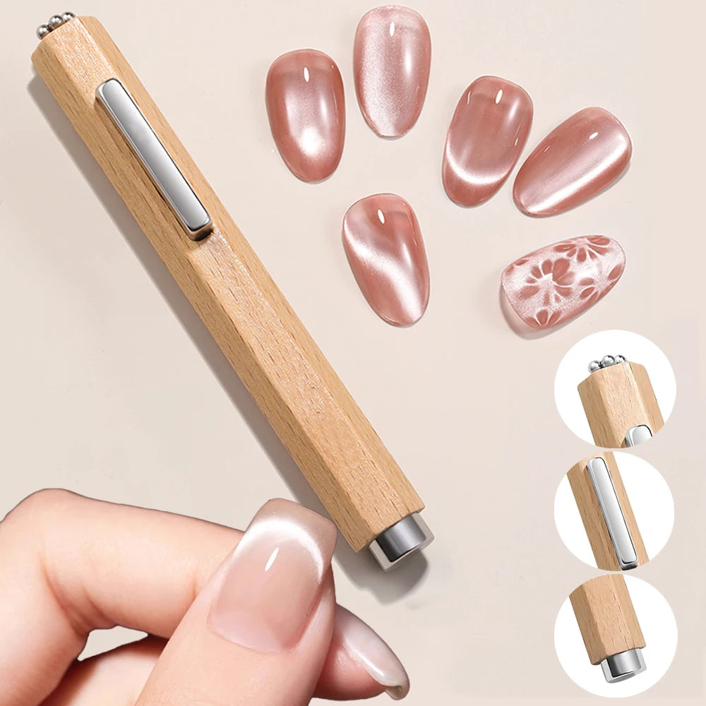 Un ensemble de aimants à clous en bois avec des ongles acryliques roses et un outil en bois assorti, tenu par une main.