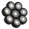 A black precision electric razor head with multiple replaceable blades arranged in a circular pattern.