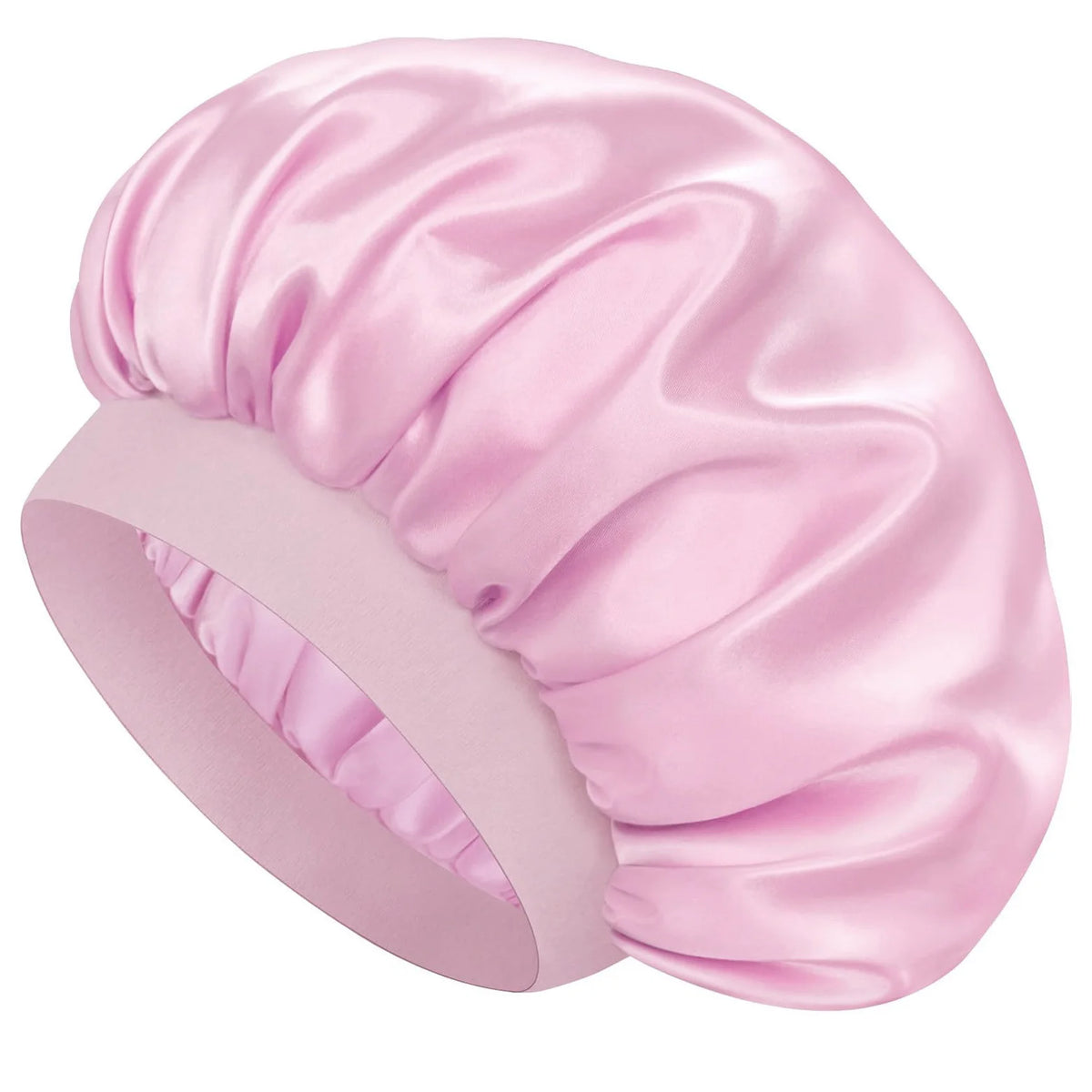 A pink double layer silk sleep bonnet for curly hair shown in a side view.