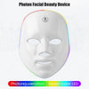 A white photon facial beauty device mask with seven-color LED lights is shown against a white background.