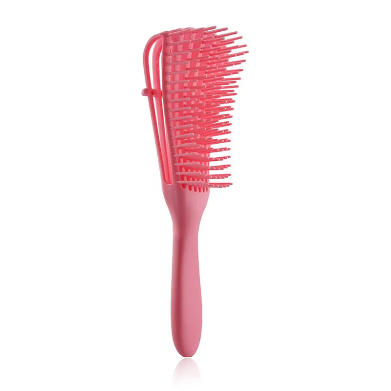 Massage du cuir chevelu rose et peigne anti-emmêlement à dents fines.
