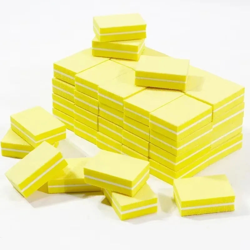 A stack of bright yellow multi-sided nail and cuticle buffing files.
