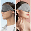 A man and a woman wearing gray 3D sleeping eye masks for sleep.