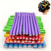 A collection of colorful soft foam heatless hair rollers in various shades of purple, green, yellow, and orange.