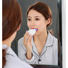 A woman is shown using a 360° Automatic Sonic Electric Toothbrush in front of a mirror.