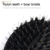 A close-up view of a black nylon teeth and boar bristle hair extension brush set.