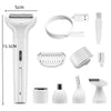 A collection of white electric hair removal tools including a main device, a cord, and various attachments.