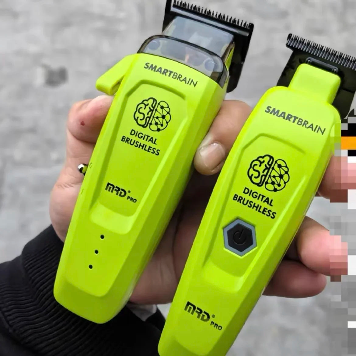 A hand holds a lime green SmartBrain digital brushless hairbrush device.