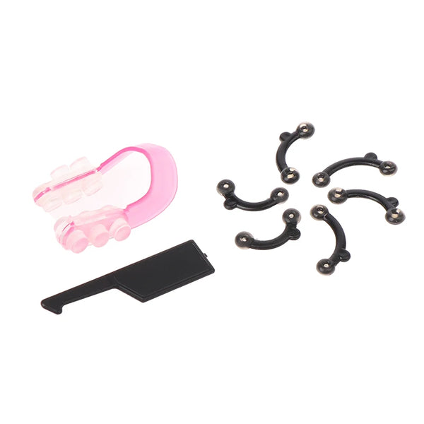 A set of pink ergonomic nose lifting and shaping clips and a black clip.